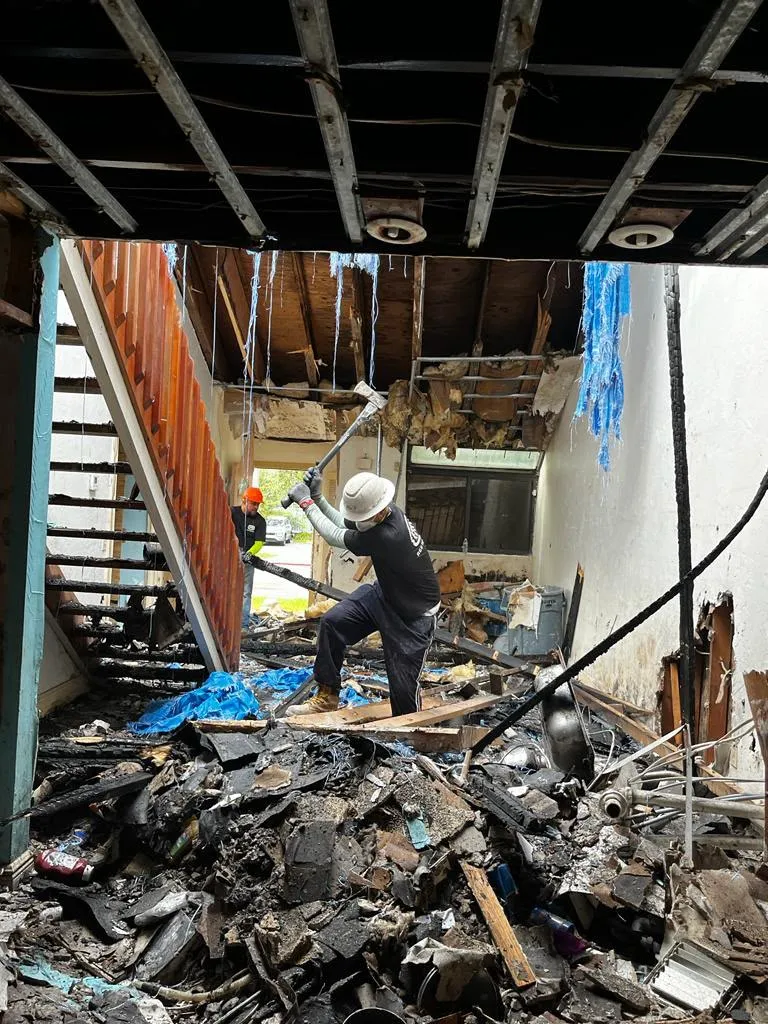 ITD Restoration crew clearing debris from a fire-damaged property