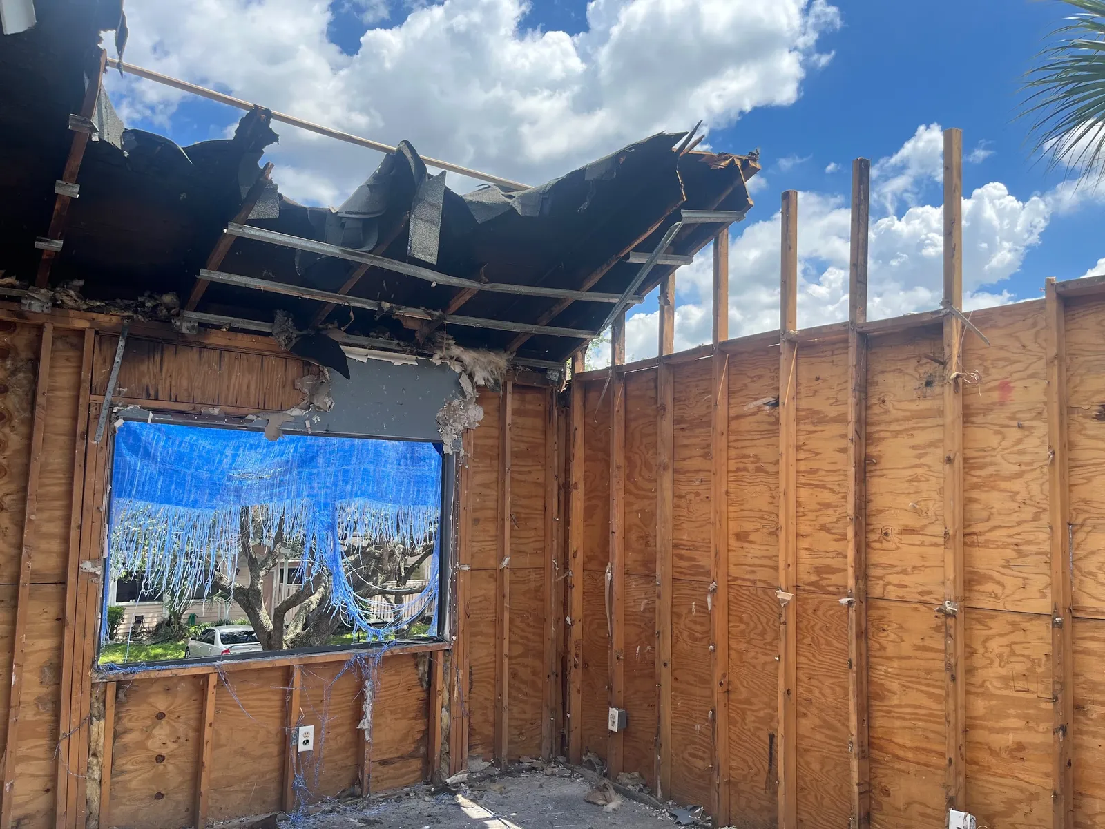 Roof torn open exposing the sky after fire damage