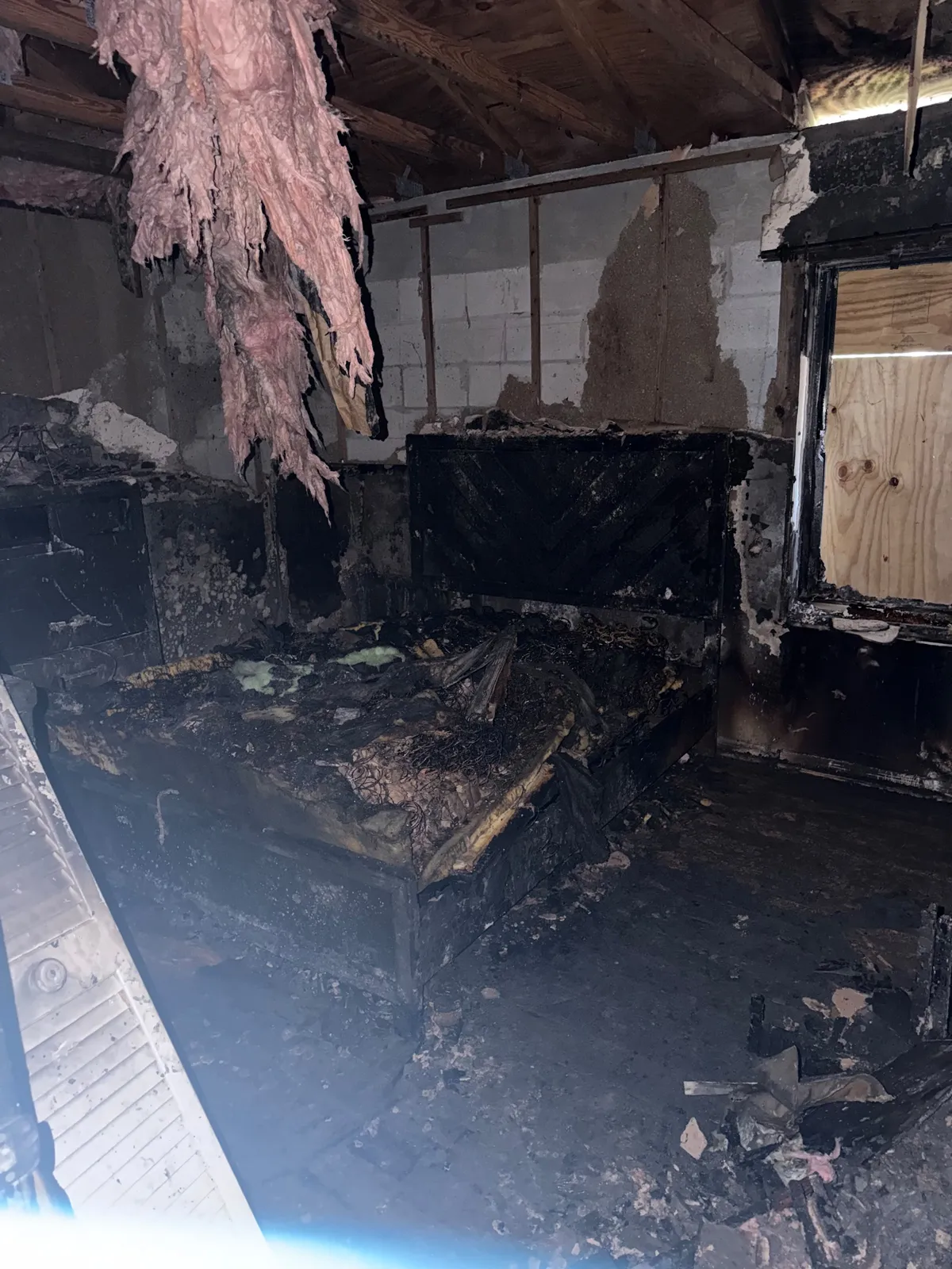 Interior room with heavy smoke damage on walls
