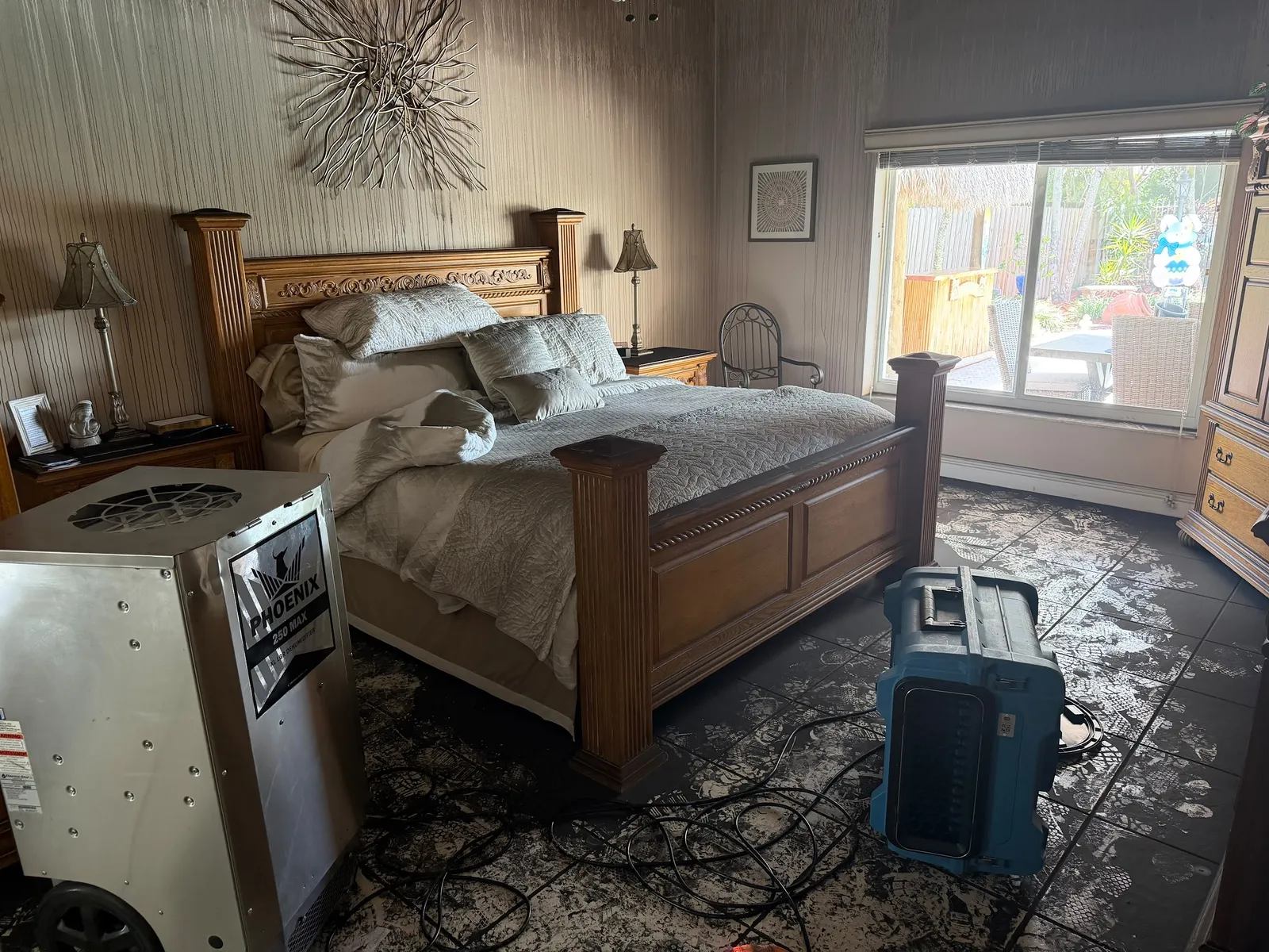 Bedroom with smoke damage staining walls and window blinds