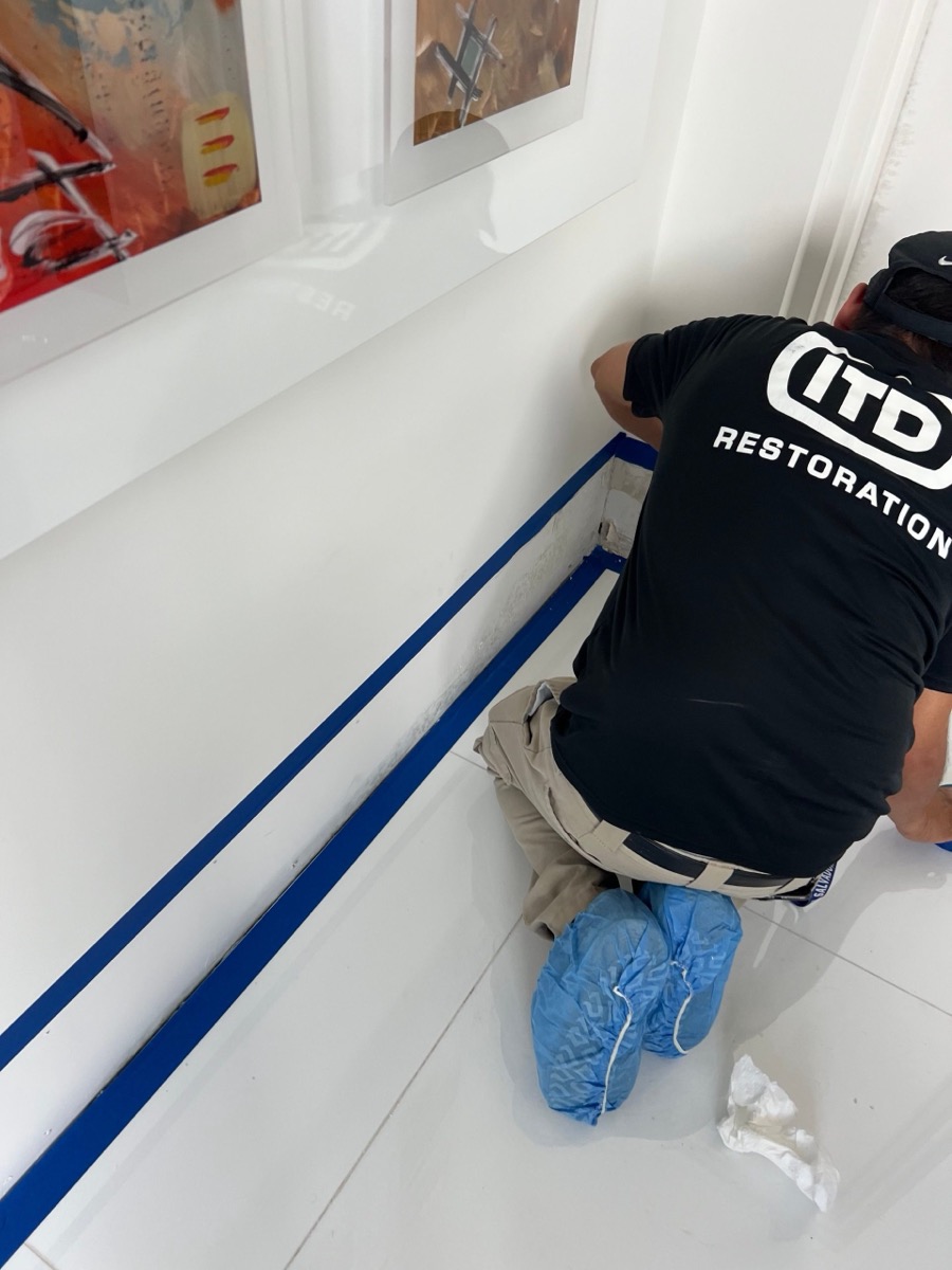 ITD Restoration technician doing detail work on a South Florida property