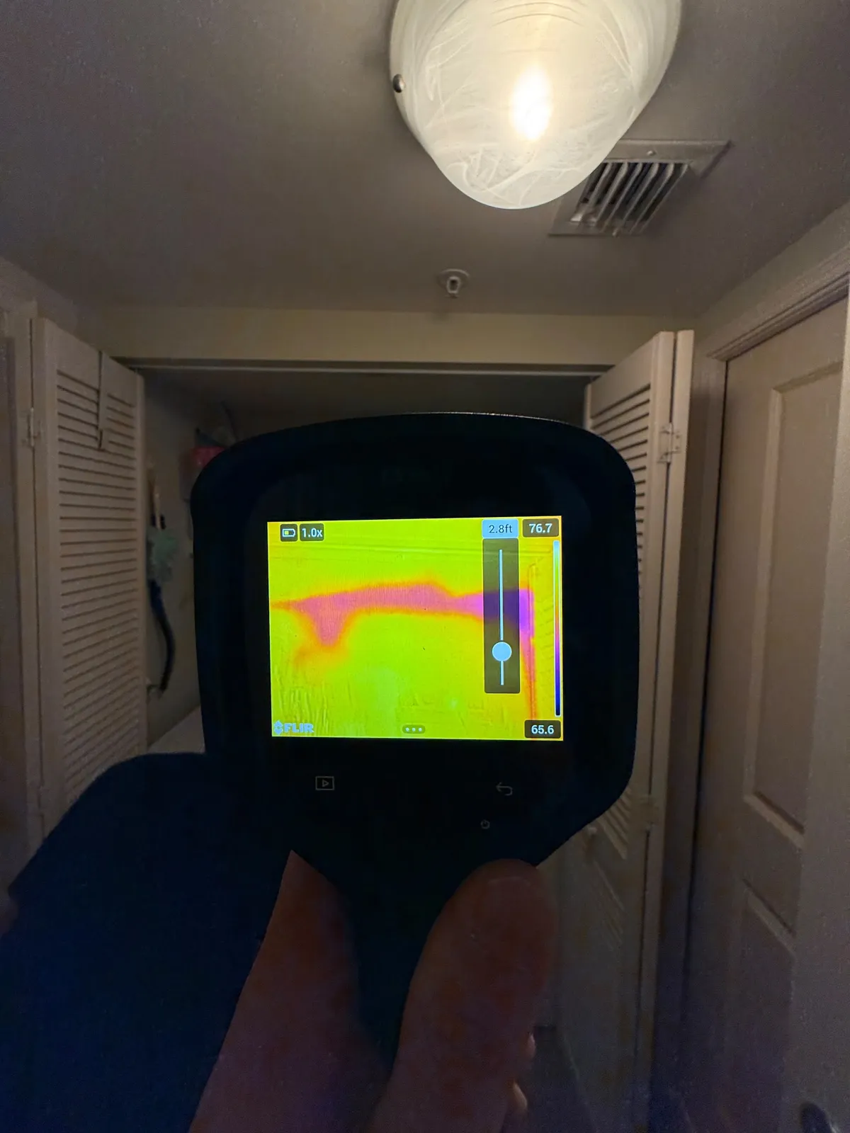 Thermal camera checking a hallway for hidden moisture
